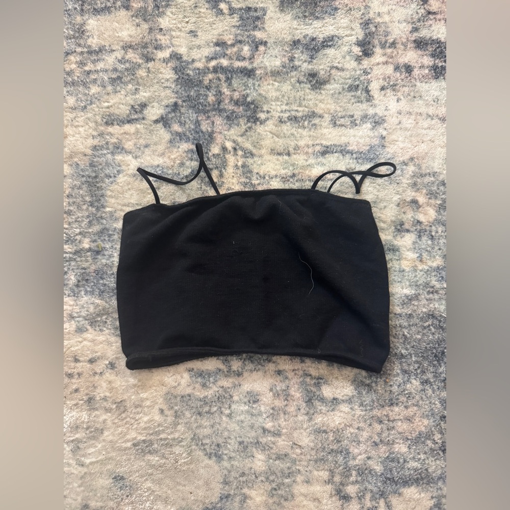 Urban Outfitters out from under open back tanktop